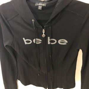 Trendy BEBE hooded zip-up with glam detail